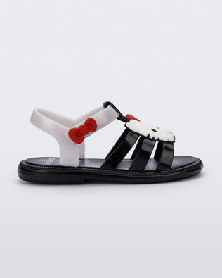 Side view of a black Hip + Hello Kitty and Friends sandal with white ankle strap and Hello Kitty on upper