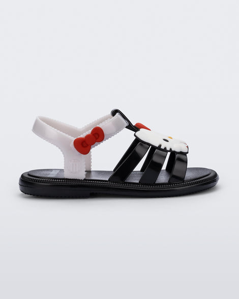 Side view of a black Hip + Hello Kitty and Friends sandal with white ankle strap and Hello Kitty on upper