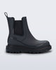 Side view of a grey Noir Boot with black sole