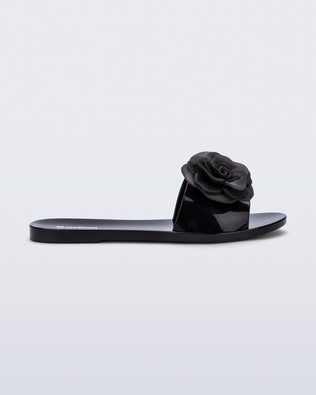 Side view of a black Babe Petals slide sandal
