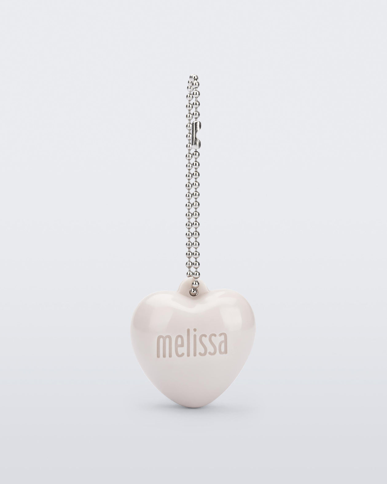 Front view of a beige Heart Charm