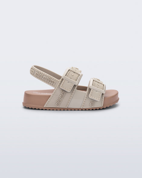Side view of a beige Cozy M Lover baby sandal