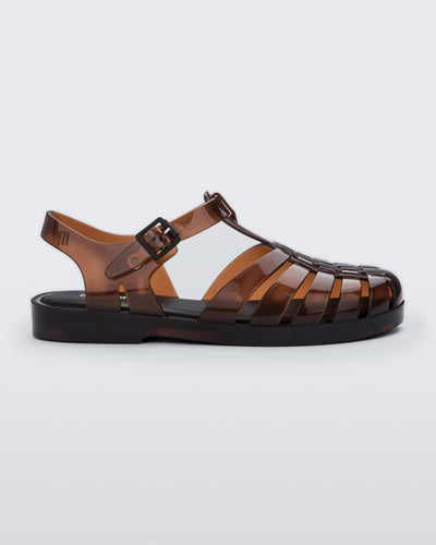 Side view of a clear brown Possession fisherman sandal