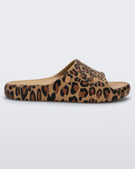 Side view of a beige Free Print slide with leopard print
