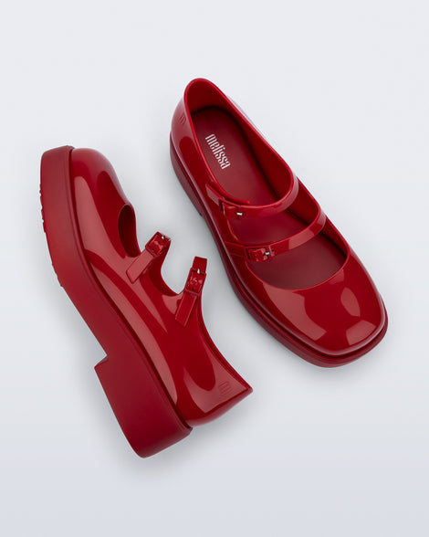 Side and top view of a pair of red Farah Low Mary jane loafers
