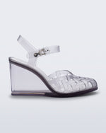 Side view of a clear grey Agata wedge heel sandal with ankle strap