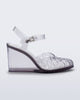 Side view of a clear grey Agata wedge heel sandal with ankle strap