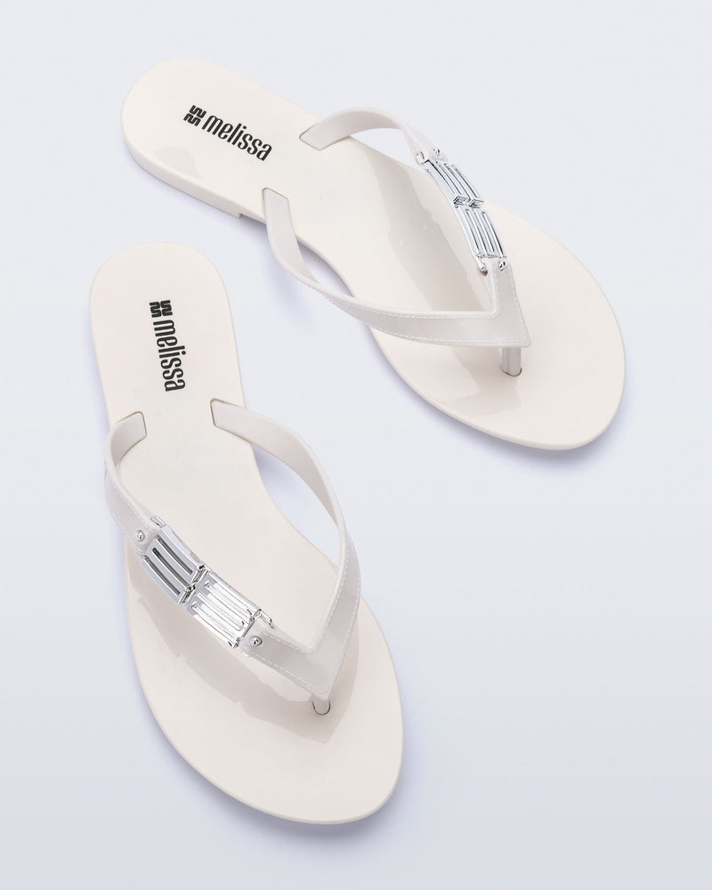 Top view of a pair of white Harmonic M Chic