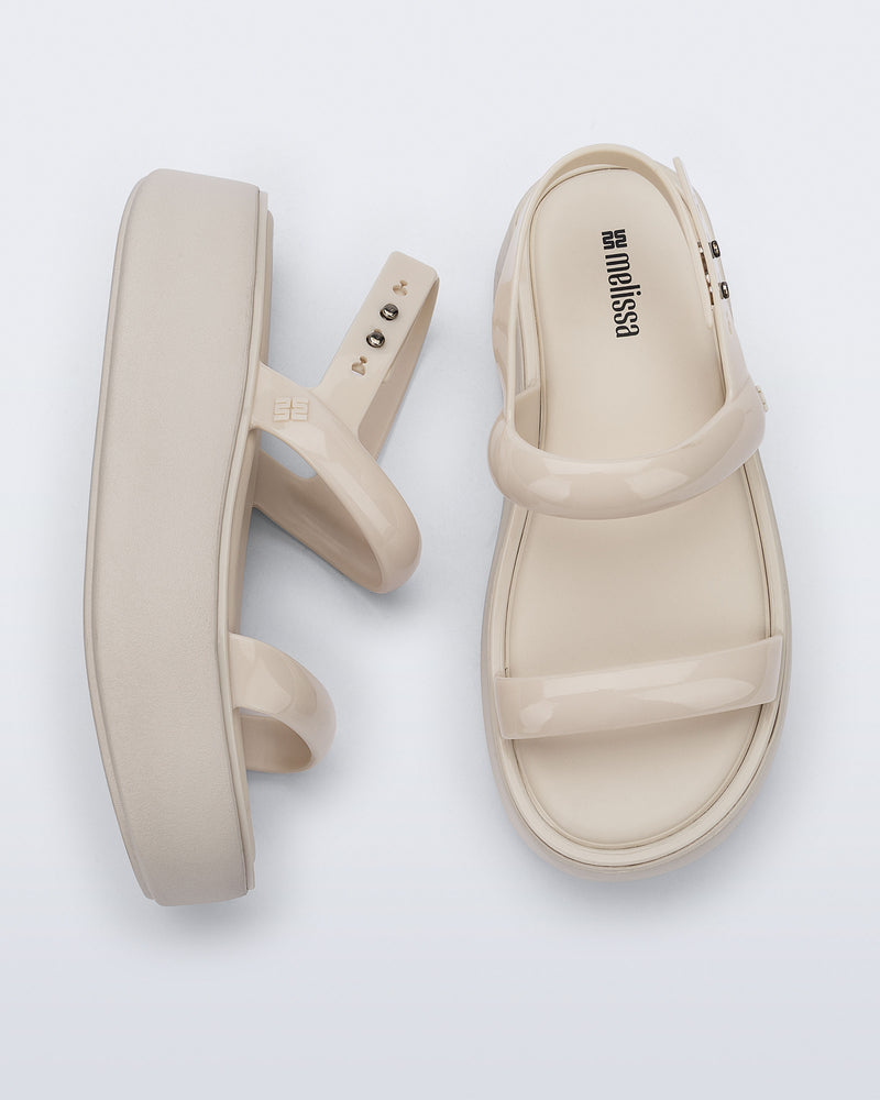 Top and side view of a pair of beige Wave Platform sandals with top and heel straps