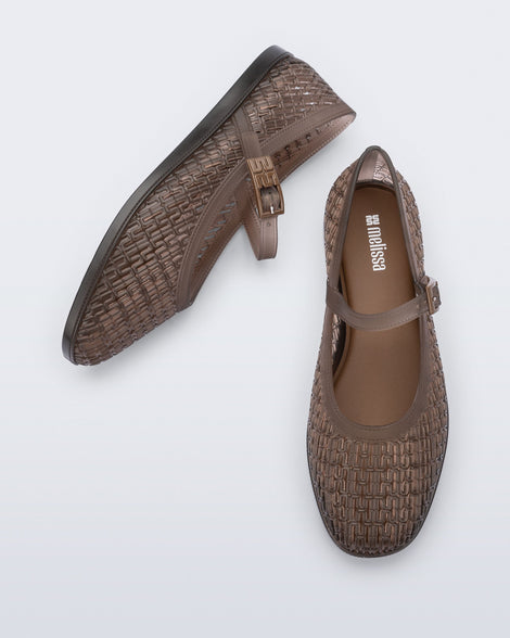 Top and side view of a pair of transparent brown Harper flats