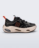 Side view of a black X Loop sneaker with beige sole