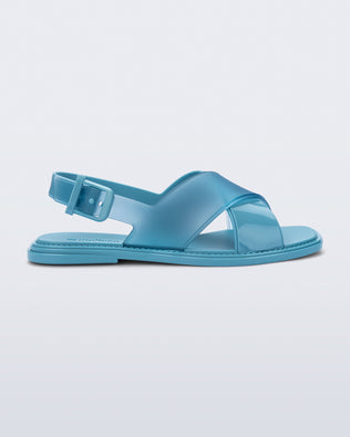 Side view of a blue Cleo sandal with back strap and crisscross top straps