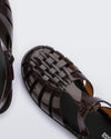 Zoomed in view of the top of a clear brown Possession fisherman sandal