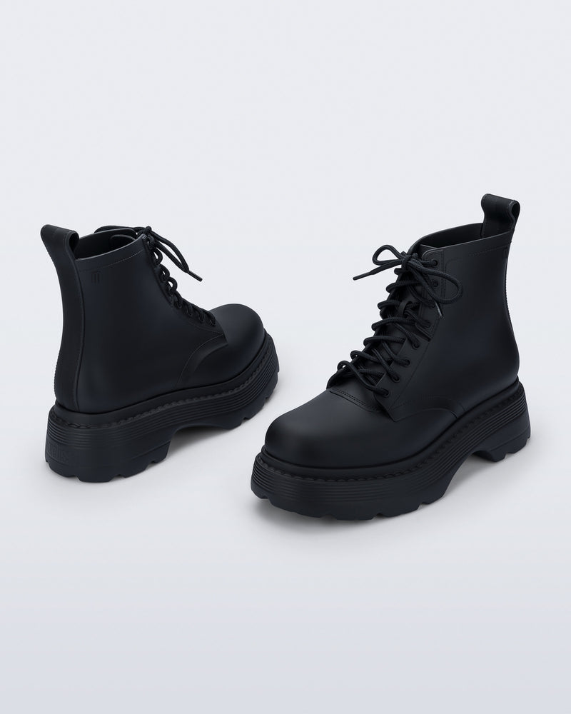 Back and front angled view of a pair of matte black Coturno Soft Platform boots