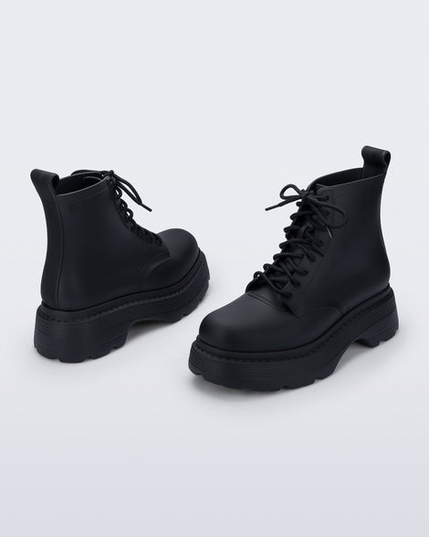 Back and front angled view of a pair of matte black Coturno Soft Platform boots