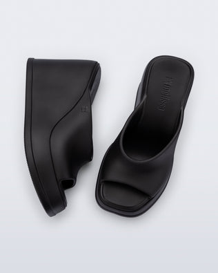 Top and side view of a pair of black Free Slip platform wedge heels