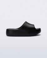 Side view of a black Free Platform Slide kids sandals