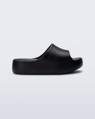 Side view of a black Free Platform Slide kids sandals