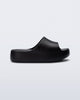 Side view of a black Free Platform Slide kids sandals