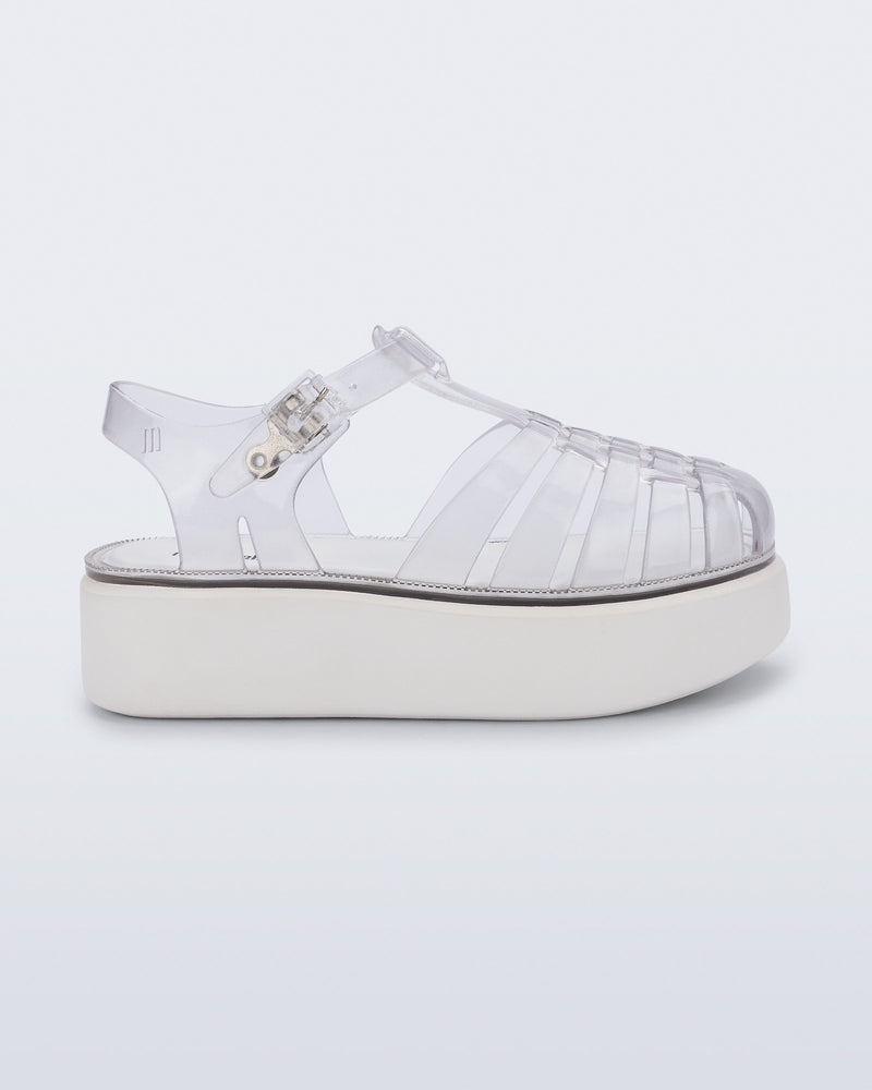 Side view of a clear Possession Platform kids fisherman sandal with white sole
