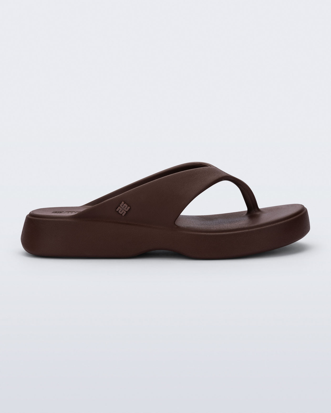 Side view of a bronze Free Thong Low flip flop