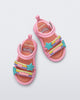 Top view of a pair of pink Create + Play Doh sandals with rainbow and star straps
