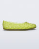 Side view of a clear green Possession Ballerina flat