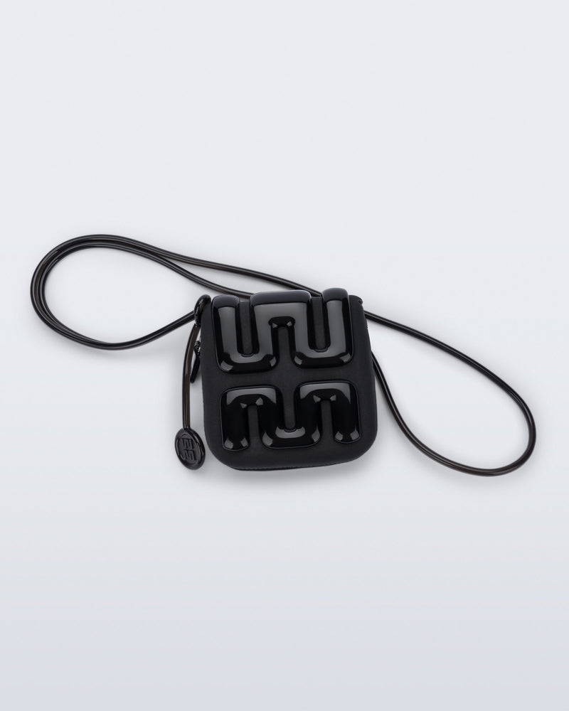 Back view of a black Jelly Wallet with inside pocket and zipper
