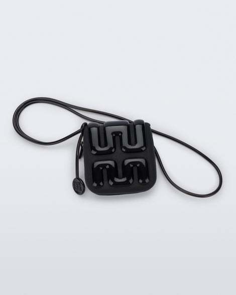 Back view of a black Jelly Wallet with inside pocket and zipper