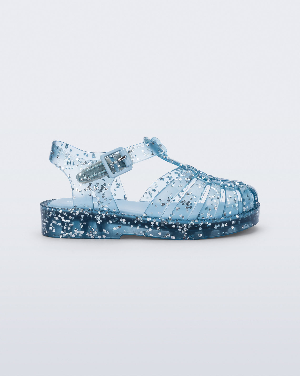 Side view of a blue Possession Elements baby sandal with glitter hearts