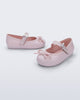 Side and angled view of a pair of pink Soft Ballerina Delicate Bow baby flats with top strap and bow