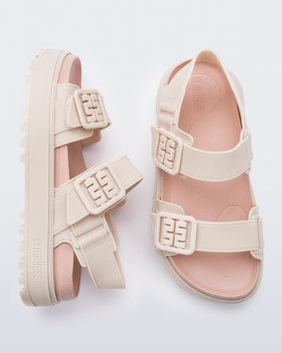 Side and top view of a pair of pink Towny sandals with straps