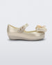 Side view of a Mini Melissa Ultragirl peeptoe ballet flat  for baby in white with star printed butterfly bow applique. 
