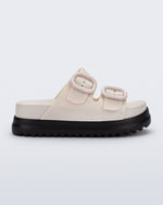 Side view of a beige Cozy Platform kids slide with two straps with buckles and black sole