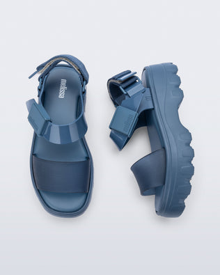 Top and side view of a pair of blue/blue Kick Off Sandals