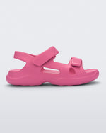 Side view of a pink Free Papete sandal