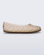 Side view of a beige Possession Ballerina flat