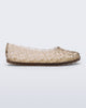 Side view of a beige Possession Ballerina flat