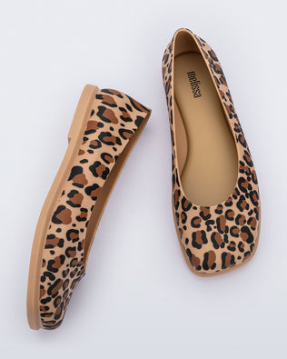 Side and top view of a pair of brown Ruby adult flats with leopard spots