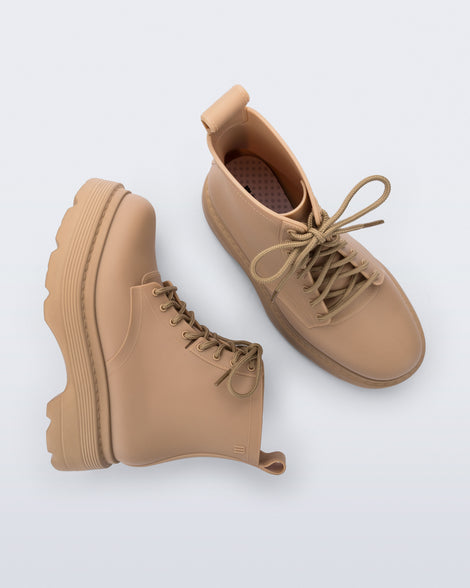 Top and side view of a pair of matte beige Coturno Soft Platform boots
