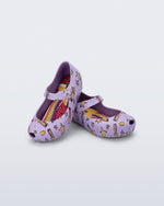 Angled view of a pair of lilac Ultragirl Colors baby flats with shooting stars
