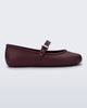 Side view of a burgundy Soft Ballerina flat with top strap and silver buckle