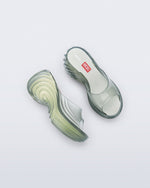 Top and side view of a pair of transparent green Platforms + Diesel slides