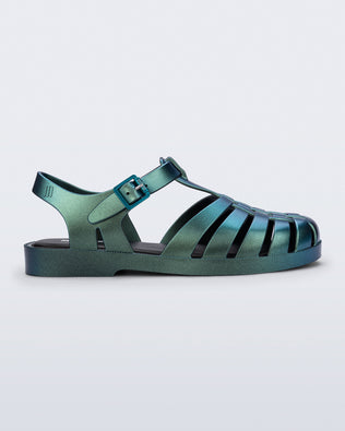 Side view of a metallic magic green Possession fisherman sandal