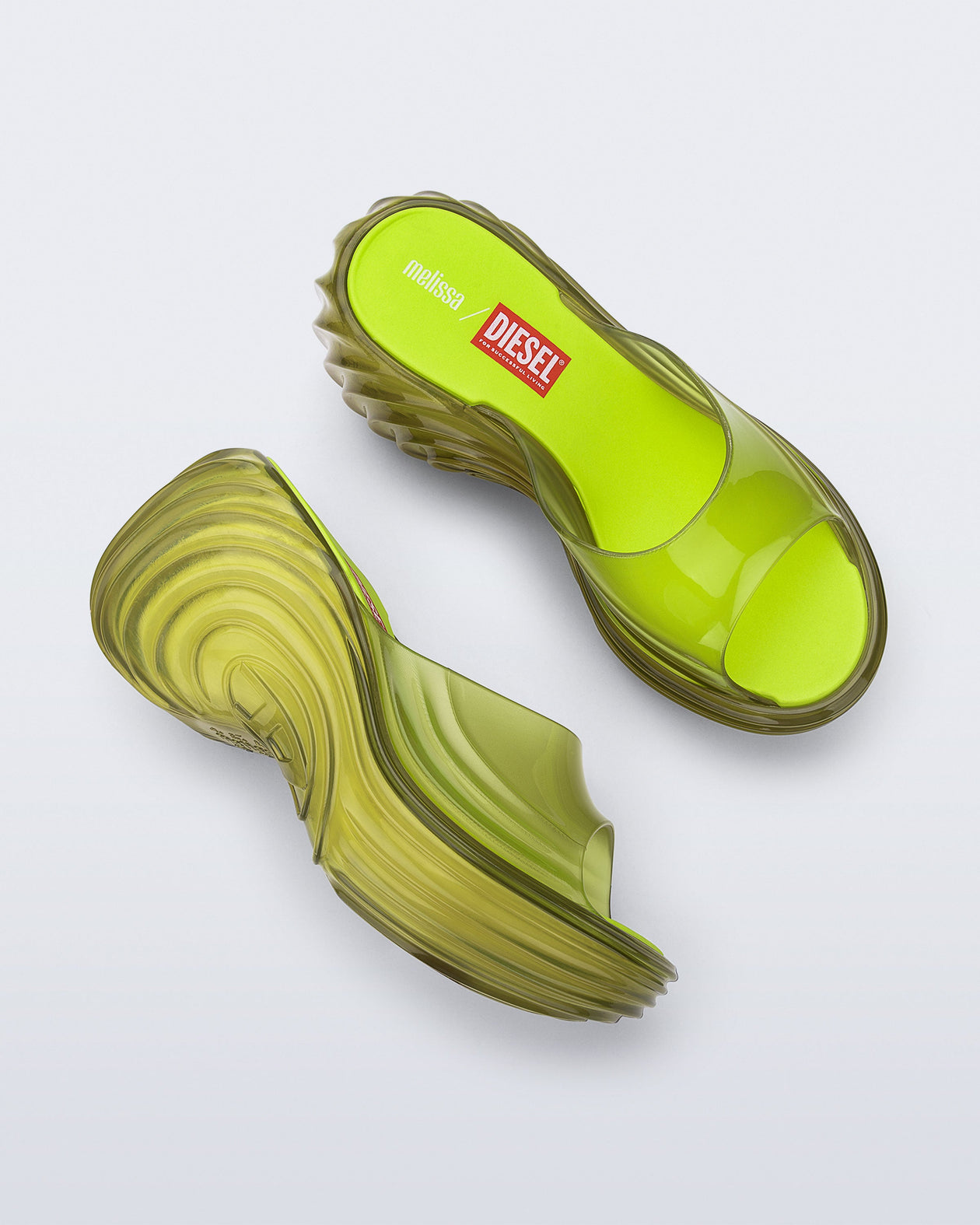 Side and top view of a pair of clear yellow Quantum Platform sandals