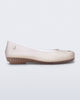 Side view of a clear beige Ultragirl Futura ballerina flat