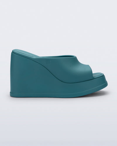 Side view of a blue/green Free Slip platform wedge heel