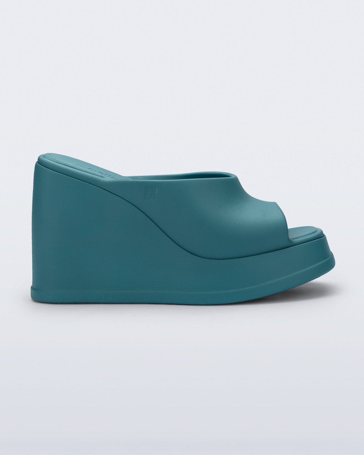 Side view of a blue/green Free Slip platform wedge heel