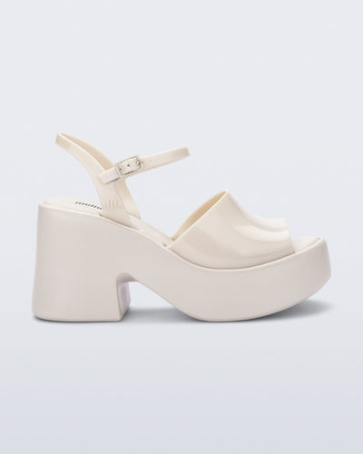 Side view of a beige Lina platform heel