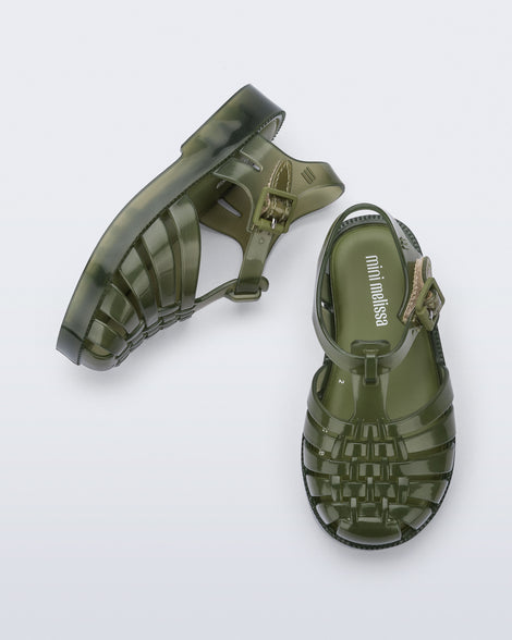 Side and top view of a pair of clear green Possession baby sandals